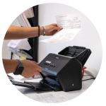 Illinois Registered Office staff member scanning a document.
